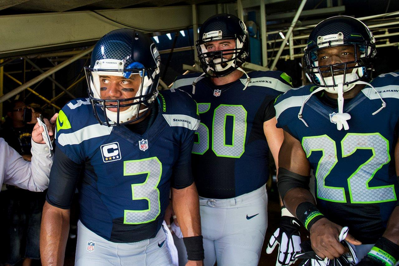 The Seahawks’ Russell Wilson, Max Unger, and Robert Turbin (Photo: Rod Mar/Seattle Seahawks)
